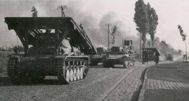 Brückenleger II (bridge-layer) of Pi. Btl 58 of the 7. Pz Div in France 1940; in the background a Ladunsleger Pz Kw I Ausf. B with &quot;Galgen&quot; (extendible and pivoting arm for laying explosive charges)....................................