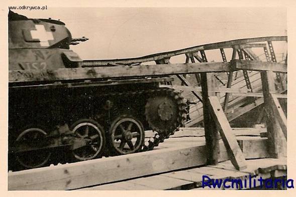 A Pz Kw I going through a bridge built by the sappers, in the background the old destroyed bridge...................