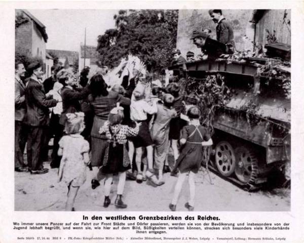 In the western border counties of the Reich. Wherever our tanks pass cities and villages on the way to the front, the local population, in particular the youth, greeted them............................