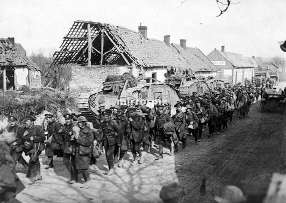 British troops passing tanks in a French village close to Amiens following the German Kaiserschlacht offensive on 21 March 1918. ...............................<br />https://www.pinterest.com/pin/387309636679993228/