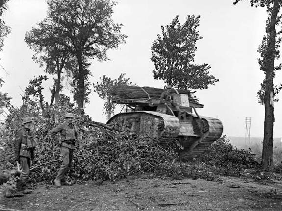 A tank breaking through an obstruction on the roadside during the Australian attack at Bayonvillers, France, 8 August 1918.........<br />http://www.ww1westernfront.gov.au/mont-st-quentin/heath-cemetery/advance-to-morcourt-valley.php#