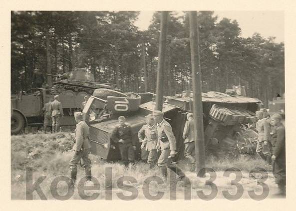 A heavy truck Faun L900 has suffered a setback and was rolled over on one of its sides losing the Pz Kw 38 (t) which was carrying .............................