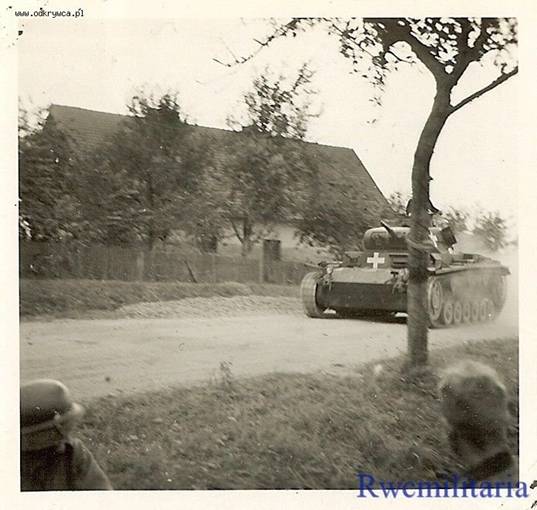 A Pz Kw III Ausf. E rolling  a top speed toward the front...................