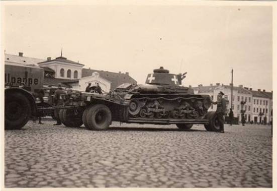 A trailer Sd. Ah. 115 carrying a Pz Kw 35 (t) ..................................