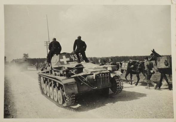 A Pz Kw II Ausf. A/B/C, (No. 43) with a column of gebirgsjägern and their mules somewhere in the Polish southern front ......................