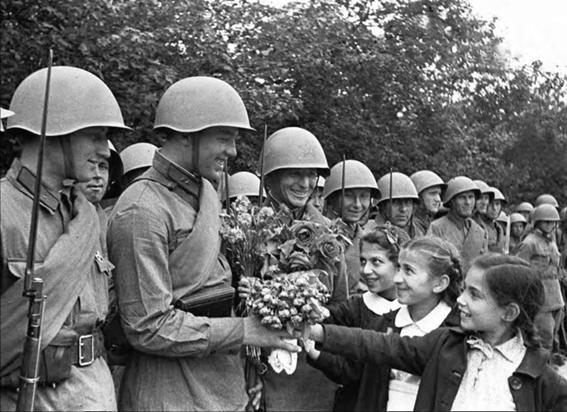 Children given flowers to Soviet troops during the military parade in Chisinau .....................................