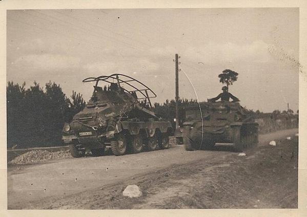 A Sd Kfz 263 (8 rad) Funkwagen leading a motorized column, which is overtaken by a Pz Kw II ........................
