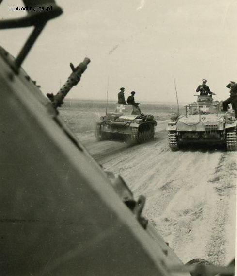Close view of a Sd Kfz 263 (8-rad) Funkwagen and beyond it a Panzerbefehlswagen III - Ausf.D1 surpassed by a Pz Kw II ...............................