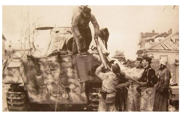 Reloading ammunition in a Pz Kw V &quot;Panther&quot; Ausf. D in Narva; the man wearing black jacket was the Chief of the 1. Coy Ostuf. Rott ....................................