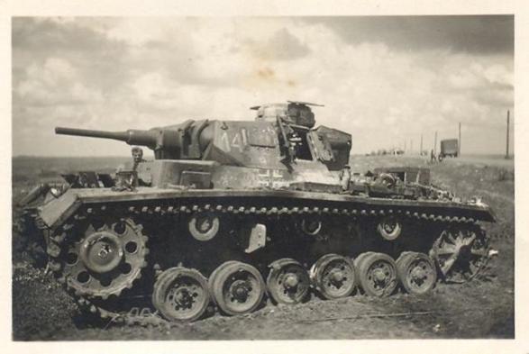 A disabled Pz Kw III Ausf. G and with signs of having suffered a fire..............................