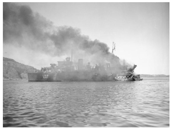 HMS Bittern ablaze in Namsos Fjord after having suffered a direct hit in the stern by an aerial bomb..............................................