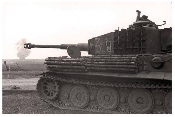 The Ldr of the Pz Kw VI Tiger Ausf. E Late Nº 300 of sPz. Abt. 507 watching the field with a scissor telescope ........................................