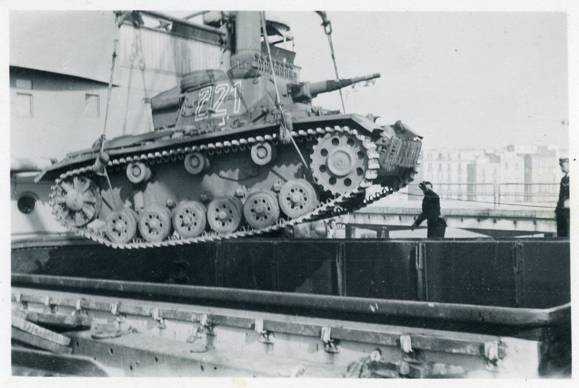 A Pz Kw III (No. 221) of PR 5 being loaded in the hold of a freighter bound for North Africa .......................